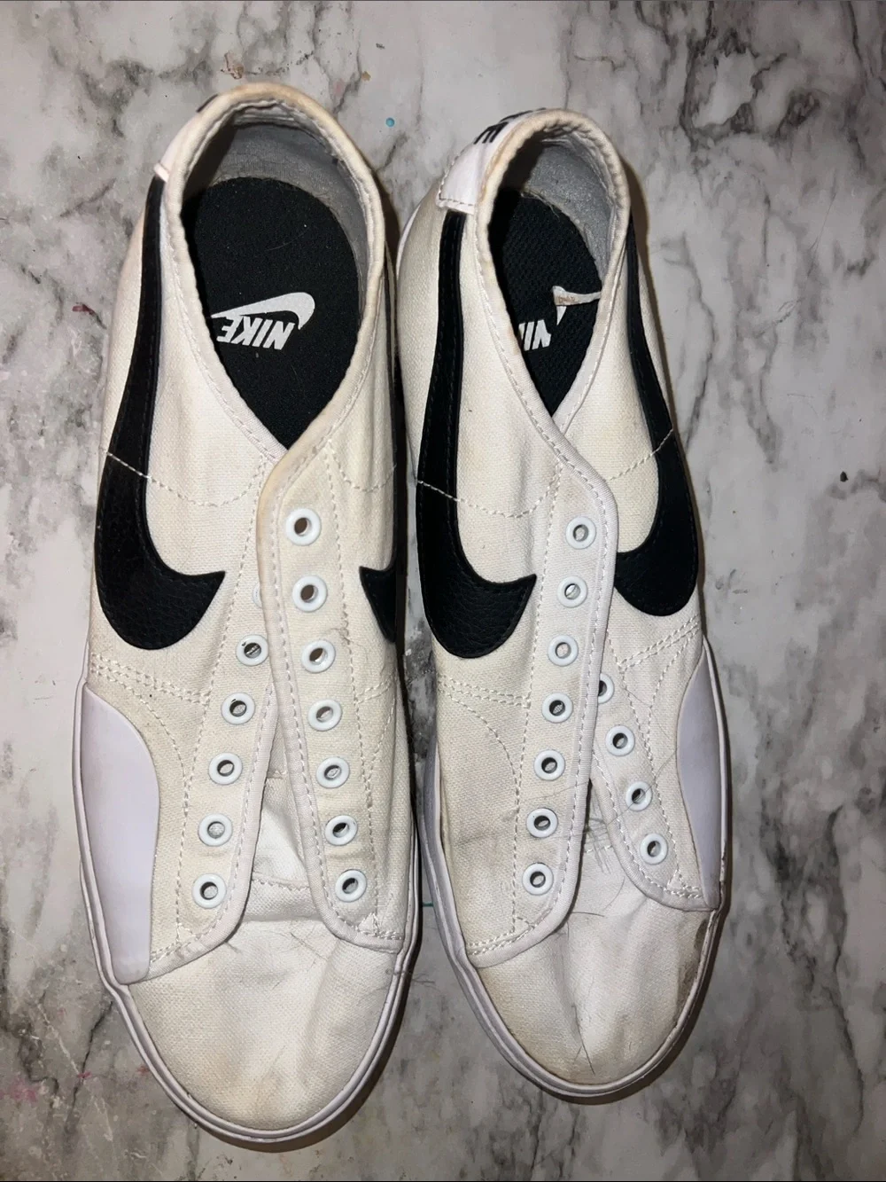 Nike Men’s White Canvas Slip-On Sneakers with Black Swoosh